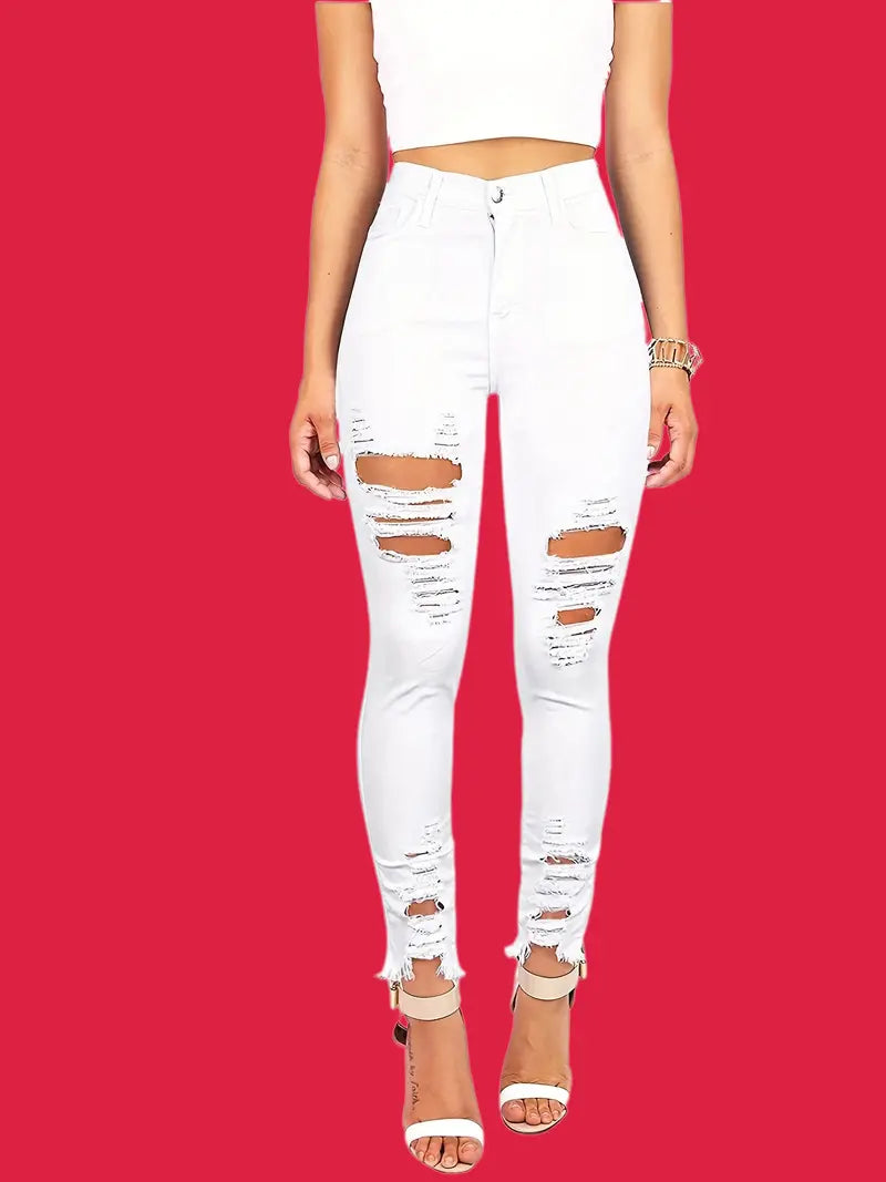 Vaqueros ajustados de cintura alta con rotos y dobladillo sin rematar